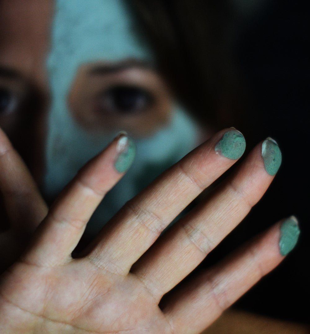 Oasis_Black_-_Byron_Mineral_Mud_Mask_-_on_face_and_fingertips.jpg
