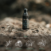 100% Organic and All Natural Face & Body Oil Featuring Black Seed Oil – BYRON – Scent inspired by Byron Bay packaged in 3ml Amber Glass Dropper Bottle pictured resting on a rock - Non Greasy, Multi-Purpose, Fast Absorbing, Vegan Friendly, Nutrient Dense, Eco-friendly, Sustainable, Waterless and Unisex Skincare Oils made by Oasis Black – Organic Botanical Skincare - Born in Morocco, Made in small handmade batches in the Byron Bay region